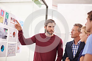 Find a way or make one. Shot of a man presenting data to his colleagues.