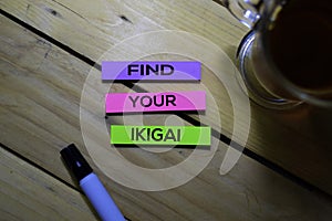 Find Your Ikigai text on sticky notes isolated on Table background. Japanese concept photo
