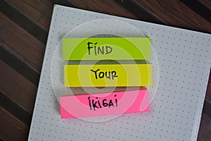 Find Your Ikigai write on sticky notes isolated on Wooden Table photo