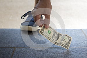 Finding and picking up money from the floor