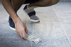 Finding and picking up money from the floor