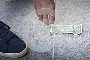 Finding and picking up money from the floor