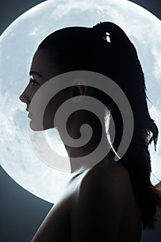 Fine Art Fashion Studio Portrait of Woman at Full Moon