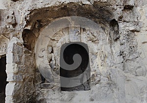 The fine Buddha statues of the longmen grottoes are carved on the cliff in the mountains