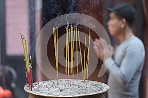 Fine candles with incense on a special stand