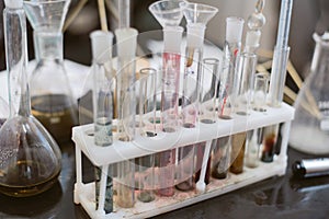 Fine chemical flasks in the laboratory. Dirty samples in a chemistry lab.