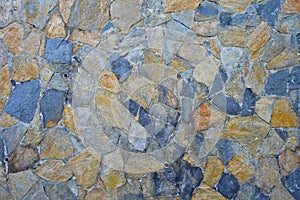 Fine cut blue and yellow stone wall