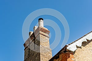 Fine detailed view of old, multiple chimneys photo