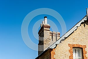 Fine detailed view of old, multiple chimneys photo