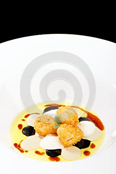 Fine dining, deep fried scallops with olive oil, cheese