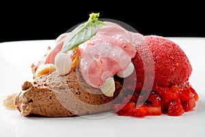 Fine dining dessert, chocolate mousse and strawberry ice cream