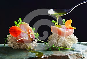 Fine dining, fresh raw ahi tuna sashimi served on an ocean sponge