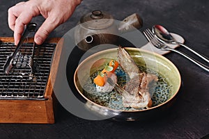 Fine Dining Meal on Plate in Restaurant. Waiter Serving Dish