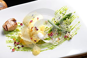 Fine dining, ravioli with asparagus and Porcini photo