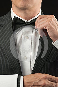 Fine Dining Waiter Adjusitg Bowtie