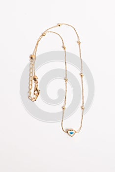 Fine Gold-Tone Chain Necklace with Eye-Inlaid Heart Pendant