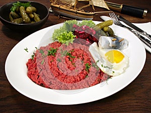 Fine Meat Hamburger Labskaus - Served with Beetroot Fried Eggs, Herring and Pickles