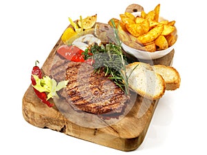 Fine Meat - Medium Grilled Beef Steak on a wooden Board with Potato Wedges