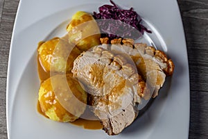 Fine Meat - Pork Roast with Crackle,  potato Dumpling and red cabbage