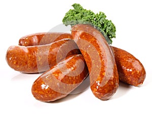 Fine Meat - Smoked Pork Sausages with Cale isolated on white Background