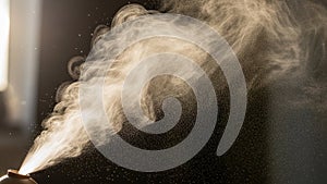 A fine mist or spray emanates