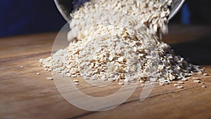 Fine oat flakes on wood