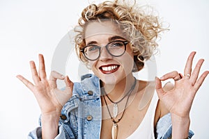 Fine it okay. Portrait of upbeat joyful and charismatic attractive young 20s girl with blond hair and glasses smiling