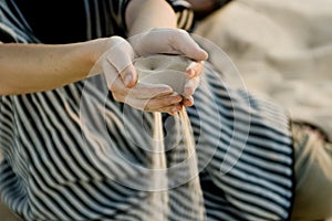 Fine sand leaking through hands - Sahara desert