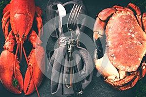 Lobster and crab on dark background