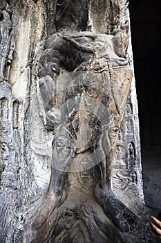 A fine statue of Buddha is carved on a rock