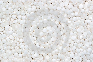 Fine white polymer granules photo