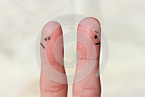 Finger art of couple. Couple after an argument looking in different directions