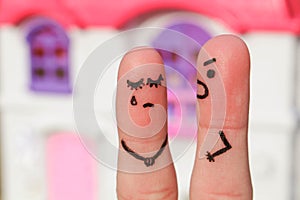 Finger art of a couple during quarrel. A man yells at a woman.