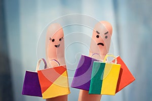 Finger art of a couple with shopping bags. Man is unhappy because he was tired of shopping