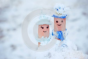 Finger art of a Happy couple on the background of snow