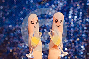 Finger art of a Happy couple. Couple making good cheer. Two glasses of champagne.