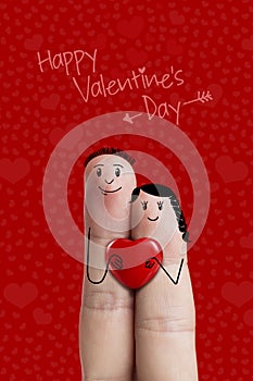 Finger art of a Happy couple. Lovers is embracing and holding red heart. Stock Image