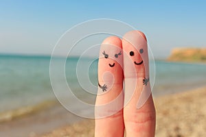 Finger art of a Happy couple. Man and woman have a rest on the beach sea. Man and woman hug on the background sea.