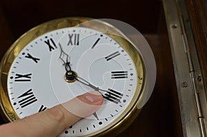 Finger on a Clock Hand