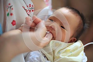 Finger Feeding breast milk by tube photo