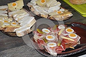 Finger food plates with raw ham and cheese u. egg