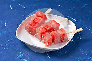 Finger food sticks with with watermelon cubes