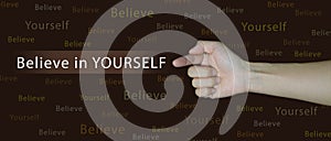 A finger on hand and arm is pointing in beside the quote believe in yourself to show that it is you who to trust. There are