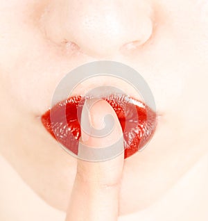 Finger on lips