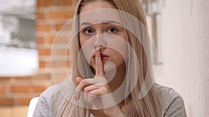 Finger on Lips, Young Woman Asking for Silence