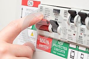 Finger on MAIN Switch on RCD Circuit Breaker Board