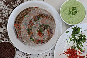 Finger millet or Ragi uthappam. Healthy pan cake made of fermented batter of finger millet and lentils