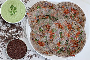 Finger millet or Ragi uthappam. Healthy pan cake made of fermented batter of finger millet and lentils