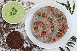 Finger millet or Ragi uthappam. Healthy pan cake made of fermented batter of finger millet and lentils