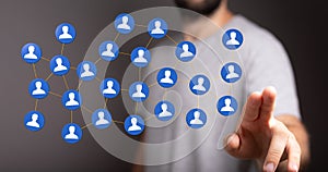 Finger pointing on 3d floating connected people icons - a concept of networking, HR, communication